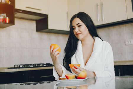 girl in a white dressing gownの写真素材