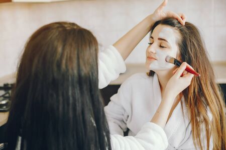 The girl wears a mask on her faceの写真素材