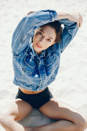 Sunny girl on a beachの写真素材