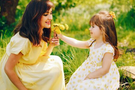 mother with daughter in a solar park
