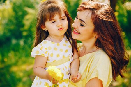 mother with daughter in a solar park