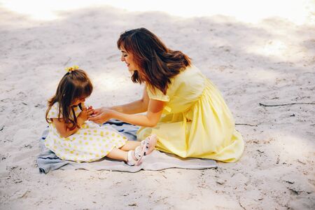 mother with daughter in a solar parkの写真素材