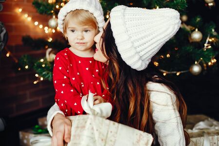 Mother with cute daughter at homeの写真素材