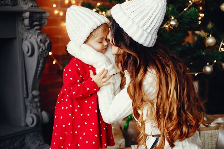 Mother with cute daughter at homeの写真素材
