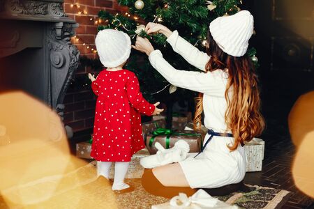 Mother with cute daughter at homeの写真素材