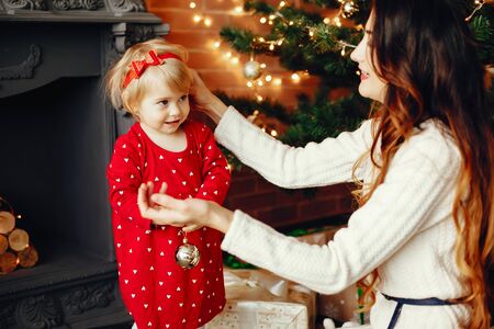 Mother with cute daughter at homeの写真素材