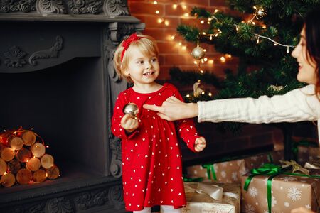 Mother with cute daughter at homeの写真素材