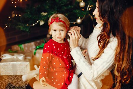 Mother with cute daughter at homeの写真素材