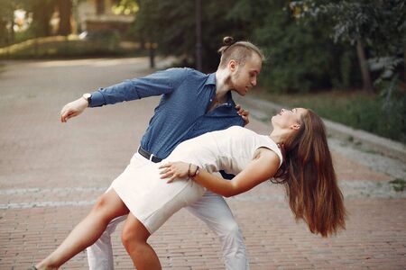 Beautiful couple spend time in a summer parkの写真素材