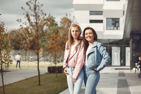 Elegant and stylish girls in a autumn parkの写真素材