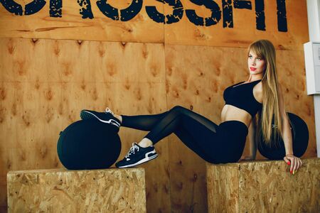 Fitness girl in a gymの写真素材