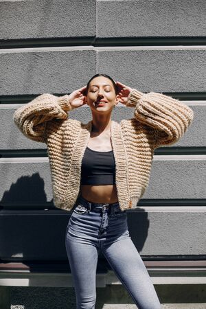 Fashion girl standing in a autmncityの写真素材