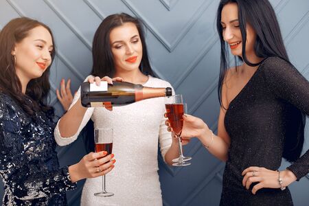 Elegant girls celebrate in the studioの写真素材