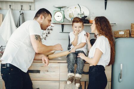Family with little son in a kitchenの写真素材