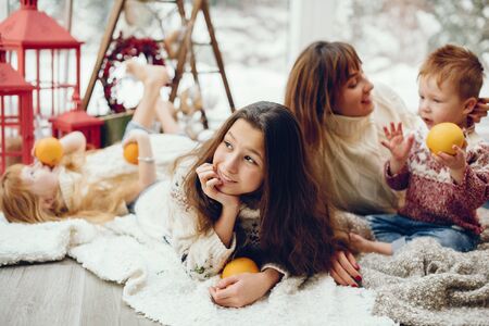 Family spending time at home in a christmas decorationsの写真素材