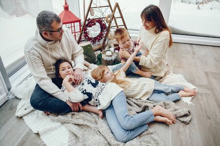 Family spending time at home in a christmas decorationsの写真素材