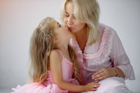 Mother and little daughter have fun at homeの写真素材