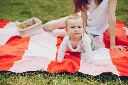 Mom and son relax in the park.の写真素材