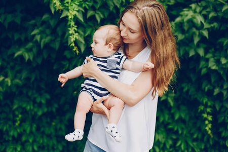 Mom and son relax in the park.