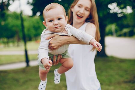Mom and son relax in the park.の写真素材