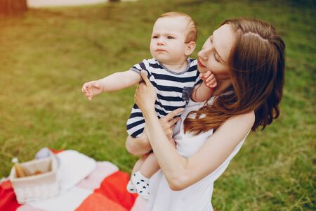 Mom and son relax in the park.