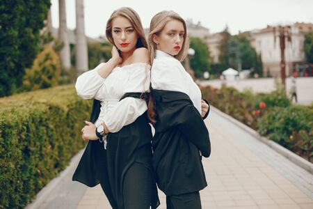 Two stylish girls in a summer cityの写真素材