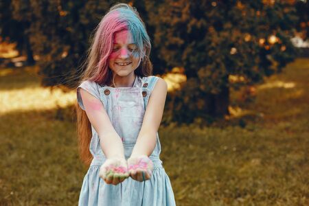 Cute girl have fun in a summer parkの写真素材