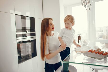 Mother and son cook the dough for cookiesの写真素材