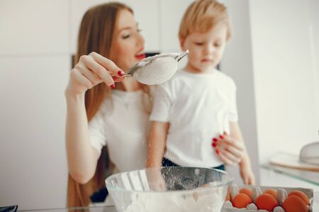 Mother and son cook the dough for cookiesの写真素材