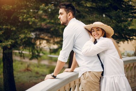 Beautiful couple spend time in a summer parkの写真素材