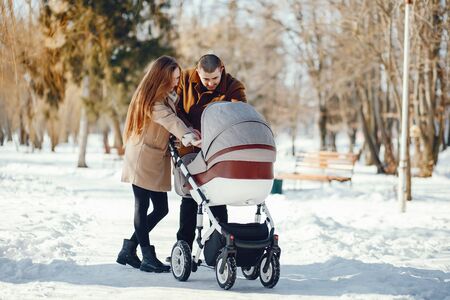 Family in a winter parkの写真素材