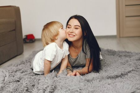 Mother and little son fun at home