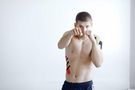 Doctor glues a tepee to an athlete at the hospitalの写真素材
