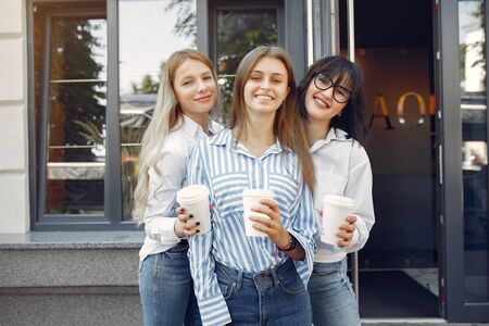 Fashion girls standing in a summer cityの写真素材