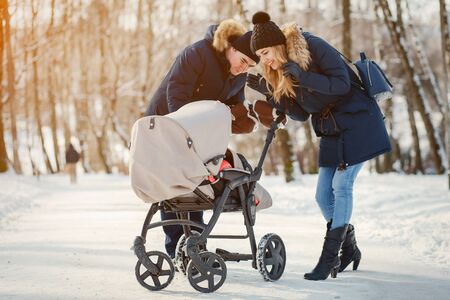 Family in a winter parkの写真素材