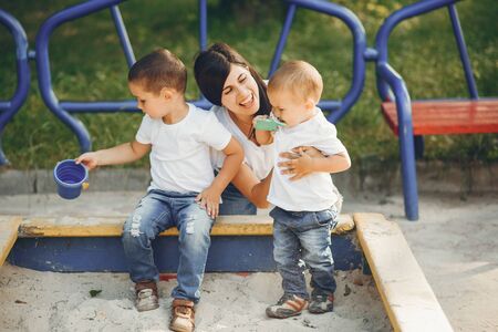 Mother with little child on a playgroundの写真素材