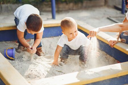 Mother with little child on a playgroundの写真素材