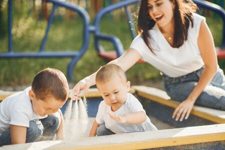 Mother with little child on a playgroundの写真素材