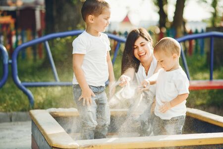 Mother with little child on a playgroundの写真素材