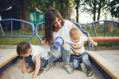 Mother with little child on a playgroundの写真素材