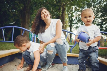 Mother with little child on a playgroundの写真素材