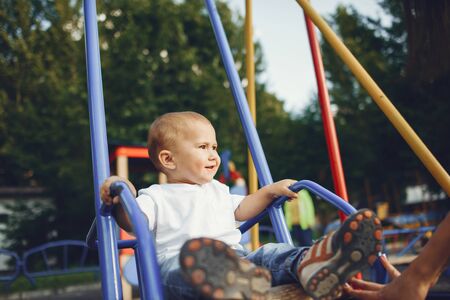 Cute little boy have fun on a playgroundの写真素材