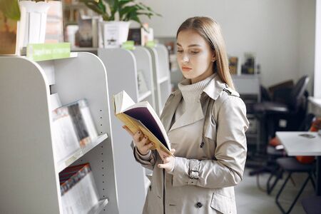 Student looking for a book in the library