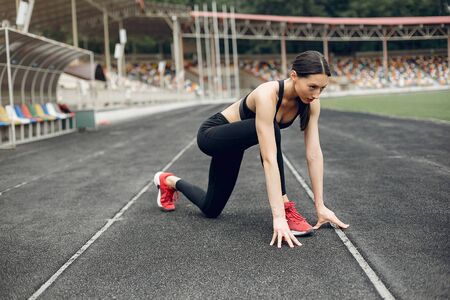 Sports girl training at the stadiumの写真素材
