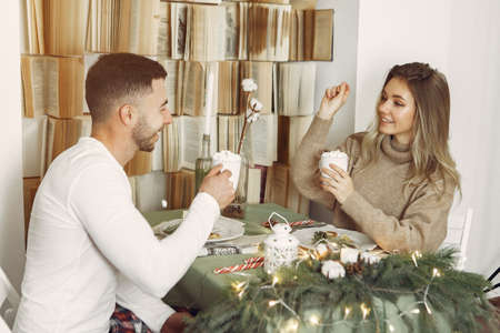 Couple spend time at home with christmas decorations