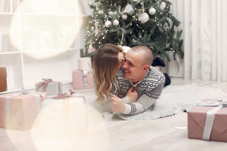 Couple spend time at home with christmas decorations