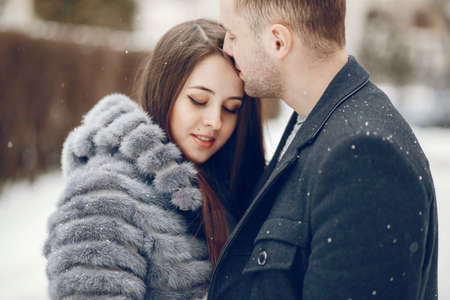 Couple in a winter cityの写真素材