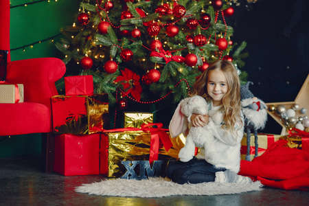 Little girl near christmas trreの写真素材