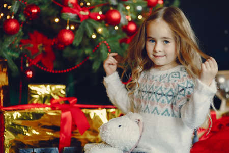 Little girl near christmas trreの写真素材