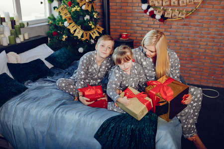 Family sitting on a bed